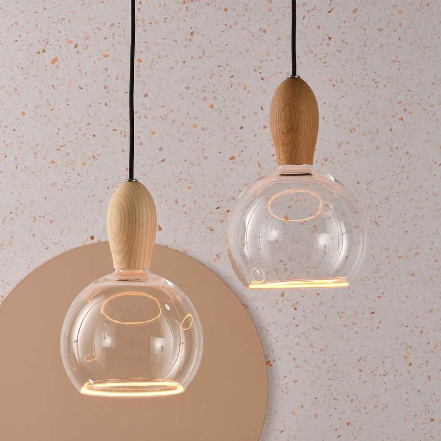Wooden pendant lighting supplied by South Charlotte Fine Lighting – the Woody light from Well Lit is shown here in Oak and Ash finishes.