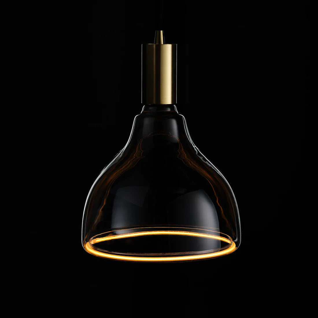 Azure S-Curve E27 Light Bulb lit up against black background