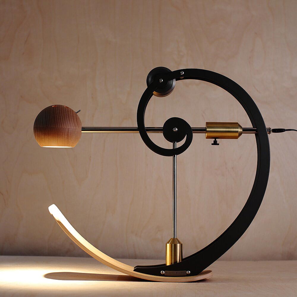 The A-Type Balance Lamp features a golden ratio spiral design and is handmade here in the UK and sold by South Charlotte Fine Lighting