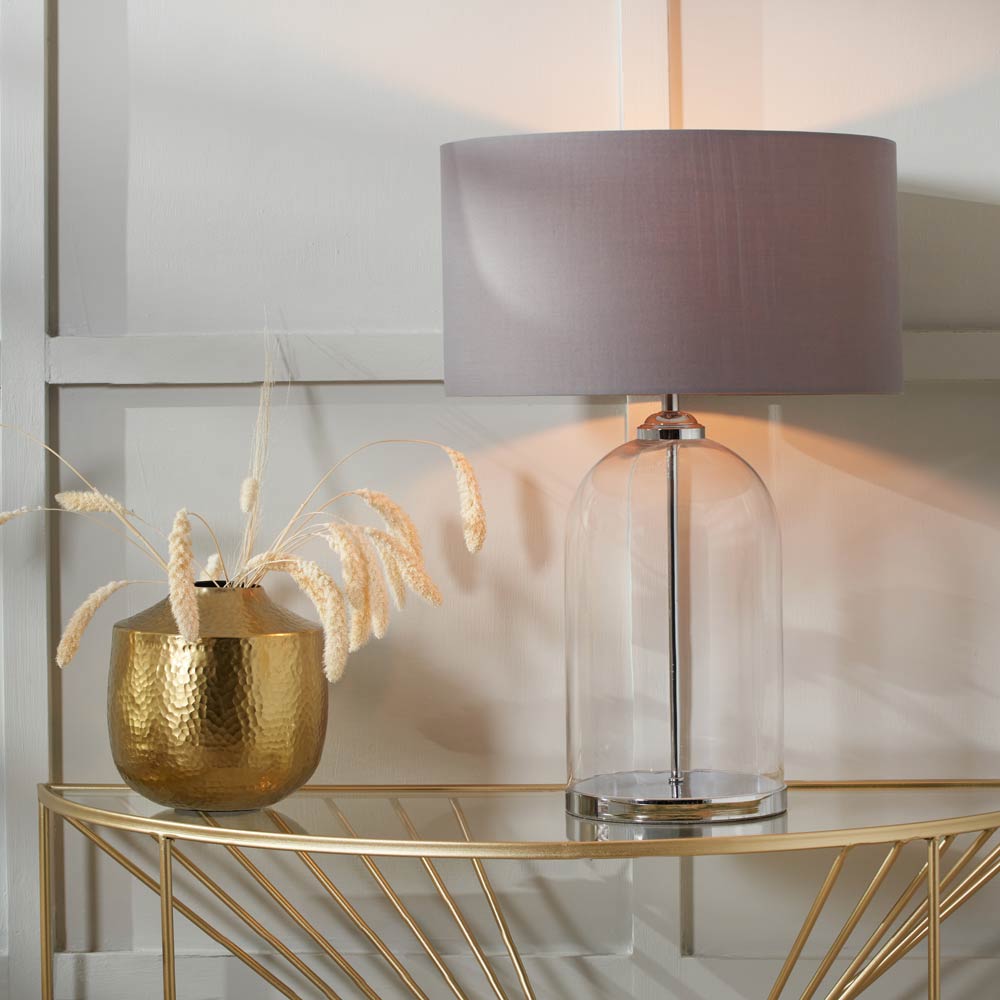 Cloche glass table lamp pictured on sidetable