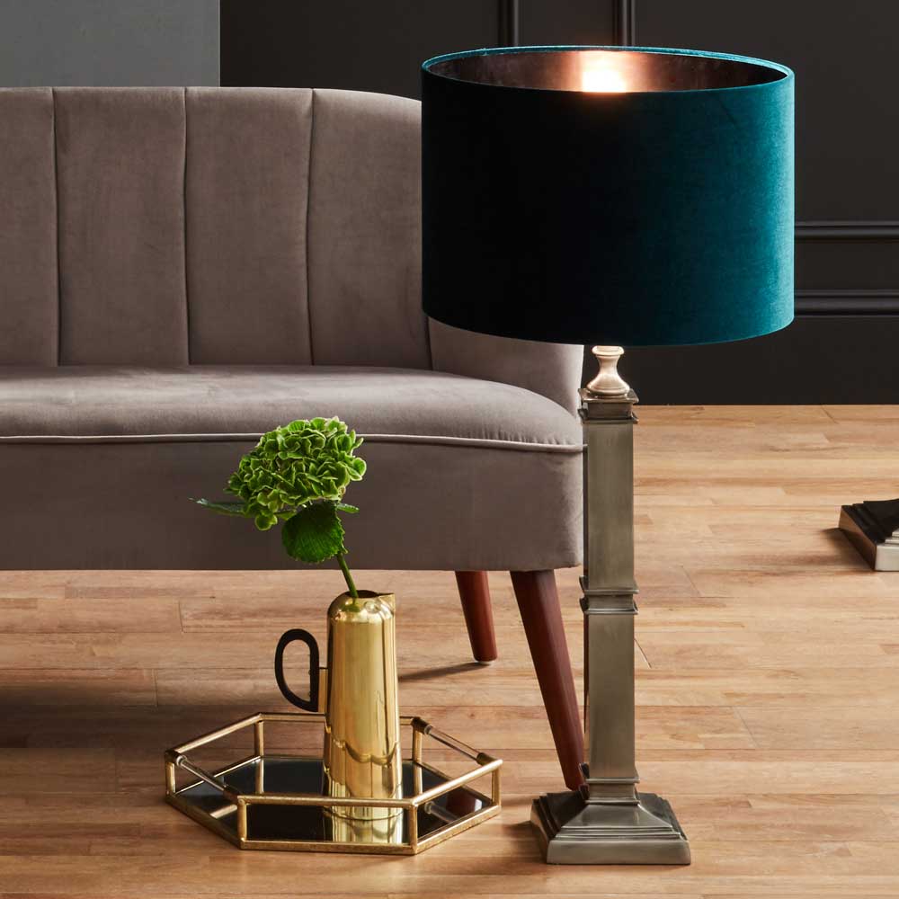 Forest green velvet lampshade on table lamp in living room