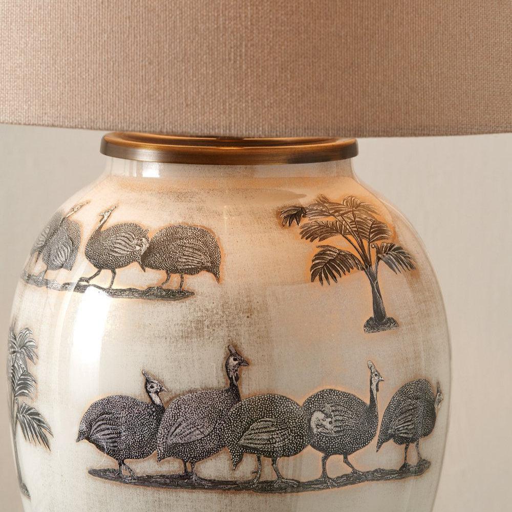 Close up on Guinea Fowl Medium Glass Table Lamp Base with taupe lamp shade