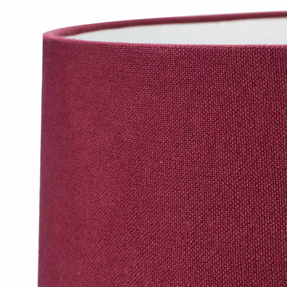 Close-up on burgundy coloured fabric on Henry lamp shade