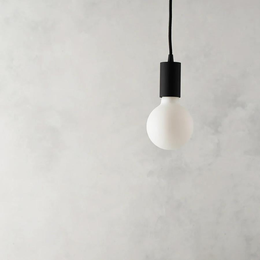 Lucina globe LED bulb shown on Spin Pendant light sold by South Charlotte Fine Lighting