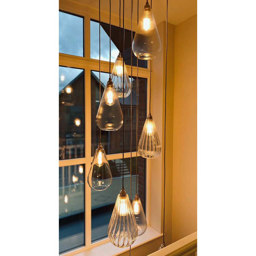 Pendant light cascade from South Charlotte Fine Lighting using Kingston glass pendant lights