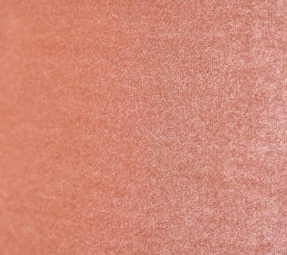 The outer velvet material on the Apricot Bow cylinder lamp sold by South Charlotte Fine Lighting