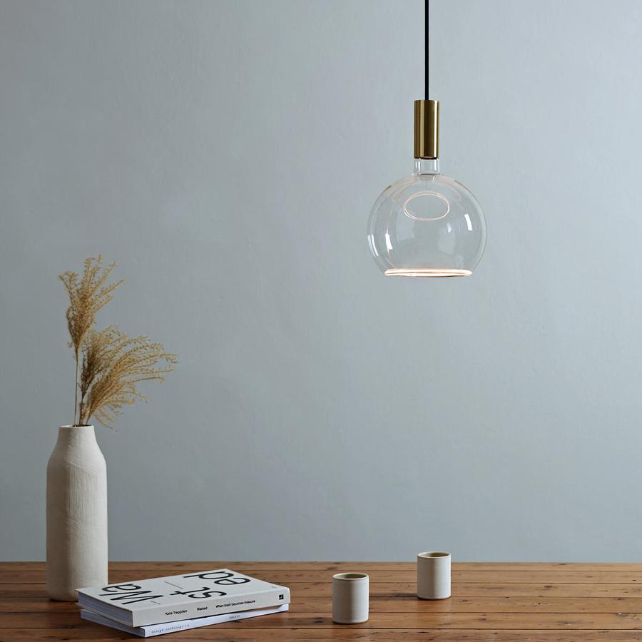Pendant lights for a kitchen island can be sourced from South Charlotte Fine Lighting, such as this Well Lit Spin Pendant Light with the Azure Globe G200 LED light bulb