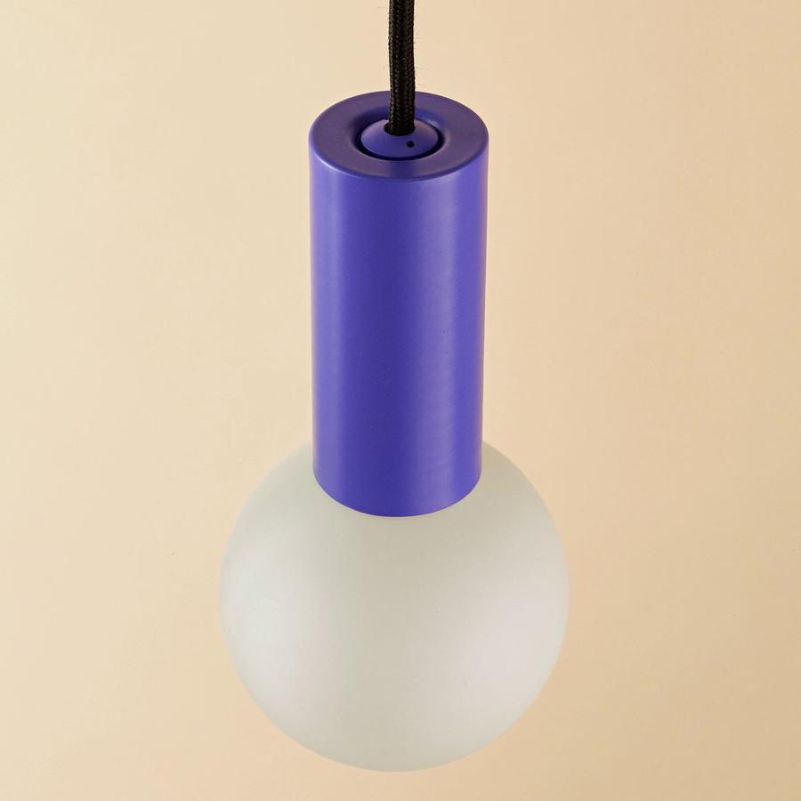 The Well Lit Spin Peri Optimistic features a bluey purple pendant body made from recycled materials and black cable and is sold by South Charlotte Fine Lighting