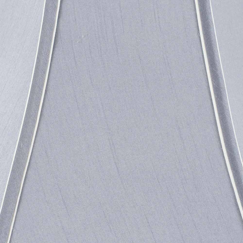 The colour of the light delivered into the room of your choice is relatively unaffected by the colour of the shade as it has a white lining which sends most of the light up or down through the main apertures