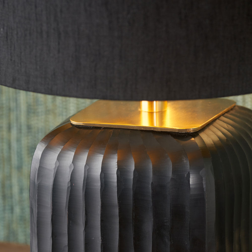 Black table lamp lit with optional black lampshade