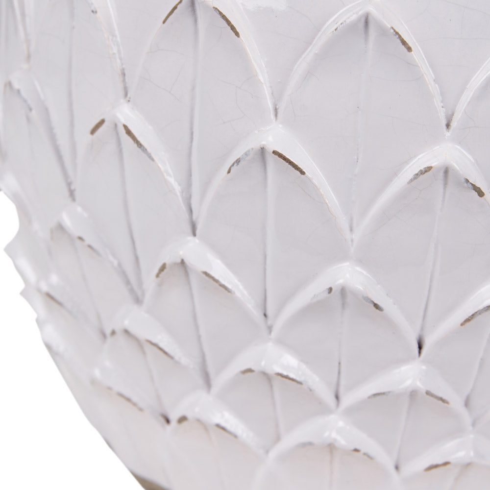 The Willow terracotta table lamp has handcrafted leaves on its side