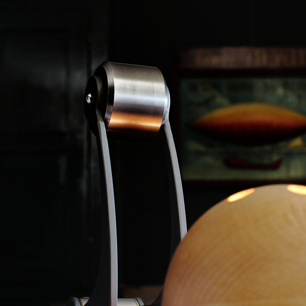 This unique desk lamp features a human figure as part of its design and is sold by South Charlotte Fine Lighting