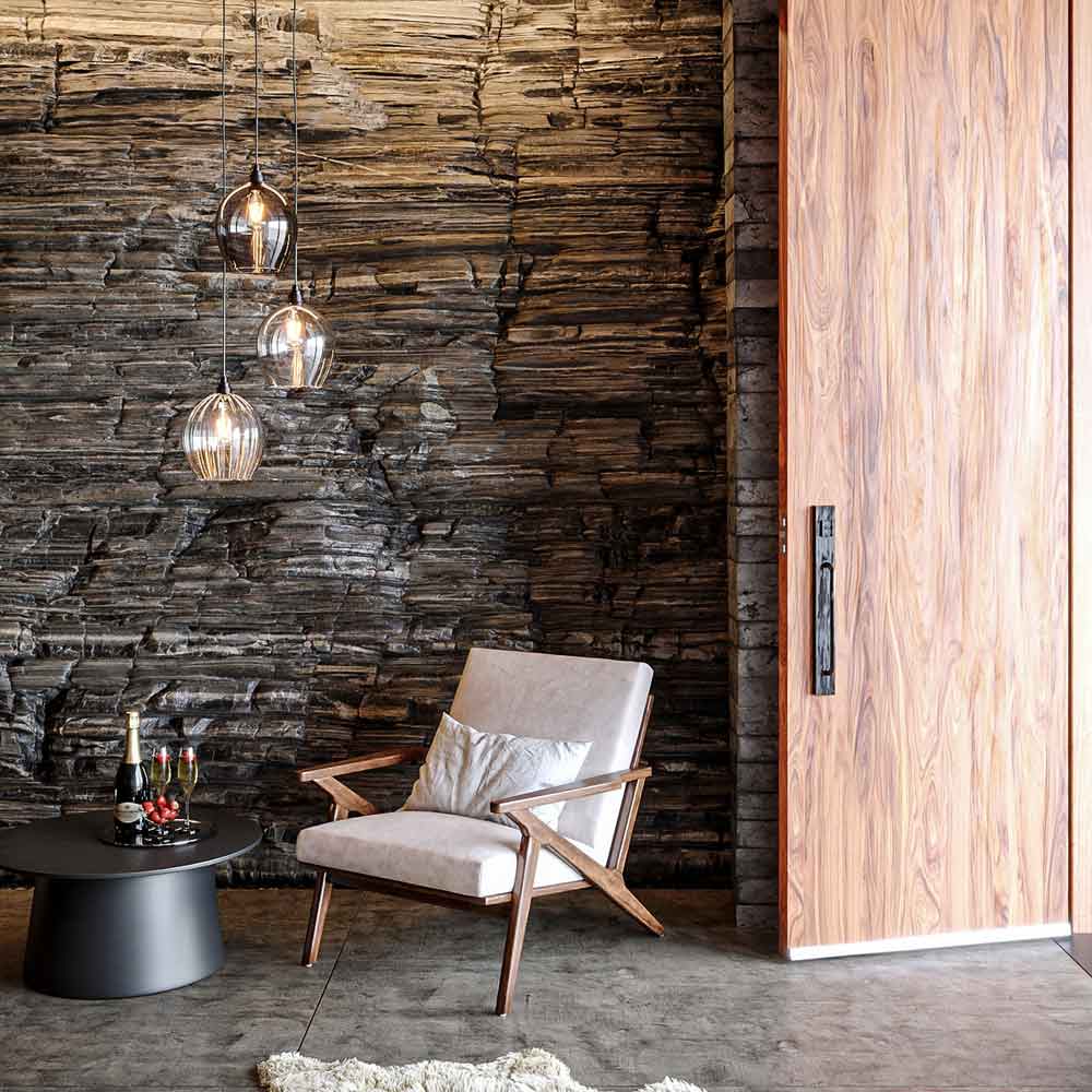 Wimbledon style 3-way glass pendant light cluster above a chair