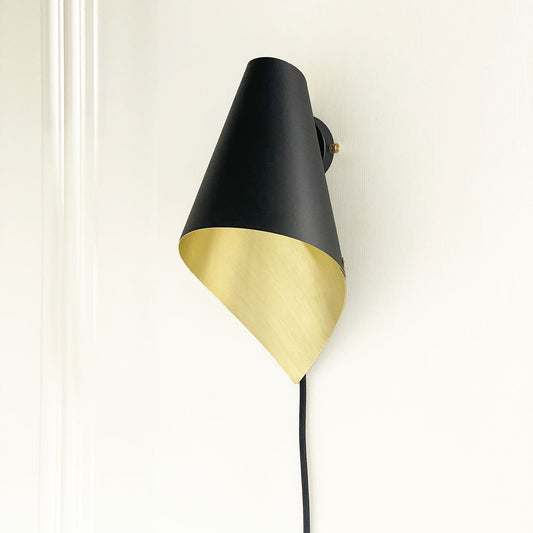 ARCFORM ARC Wall Light Plug In shown here in matt black and brushed brass, supplied by South Charlotte Fine Lighting