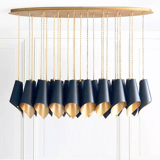 The Arcform ARC 25 modern black chandelier is shown here with a gold lacquer finish on the inside of the shades, supplied by South Charlotte Fine Lighting