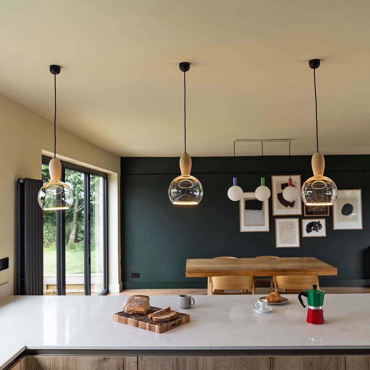 The Woody wood pendant light is supplied by South Charlotte Fine Lighting and can be used to light a breakfast bar