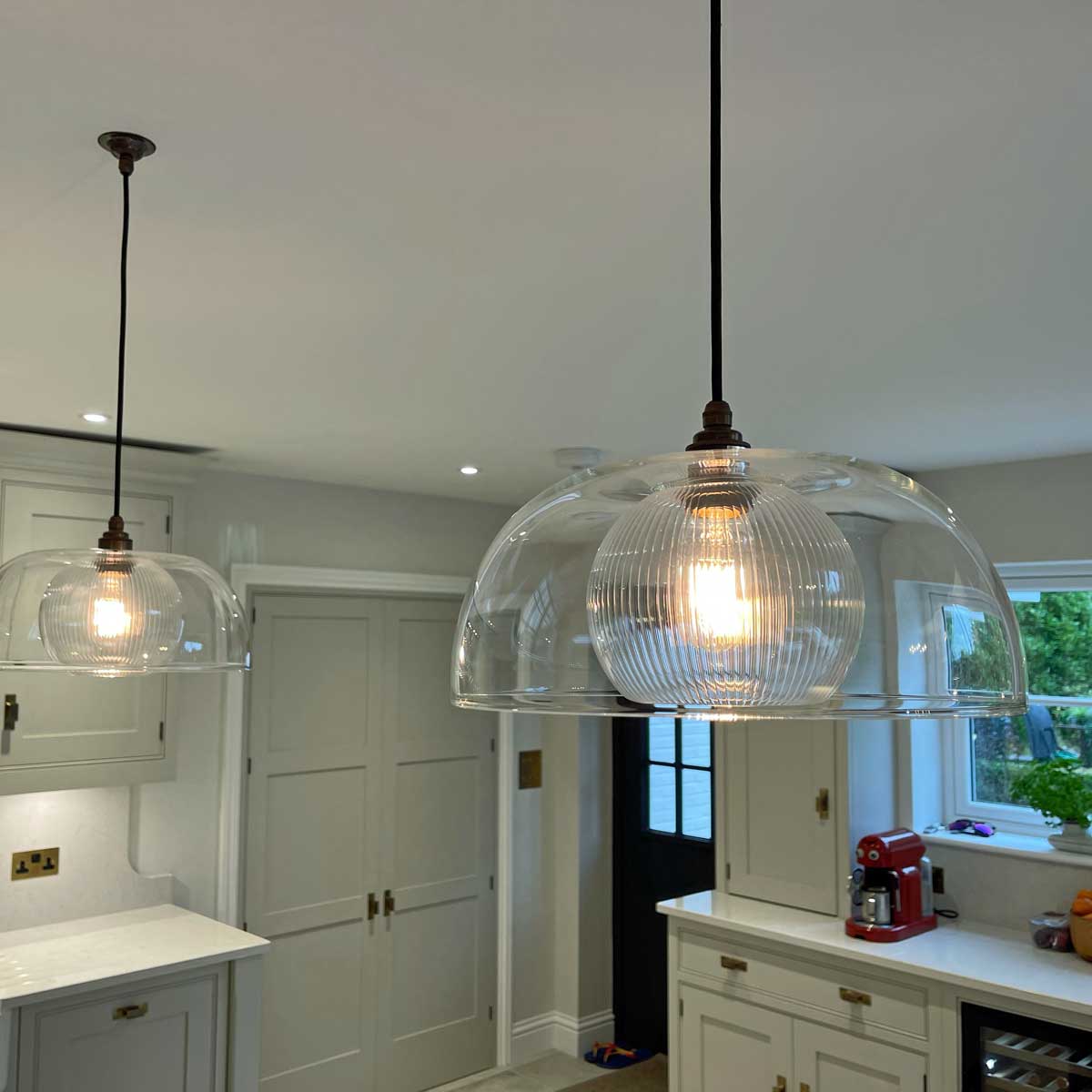 Glass pendant light large for your kitchen and sold by South Charlotte Fine Lighting