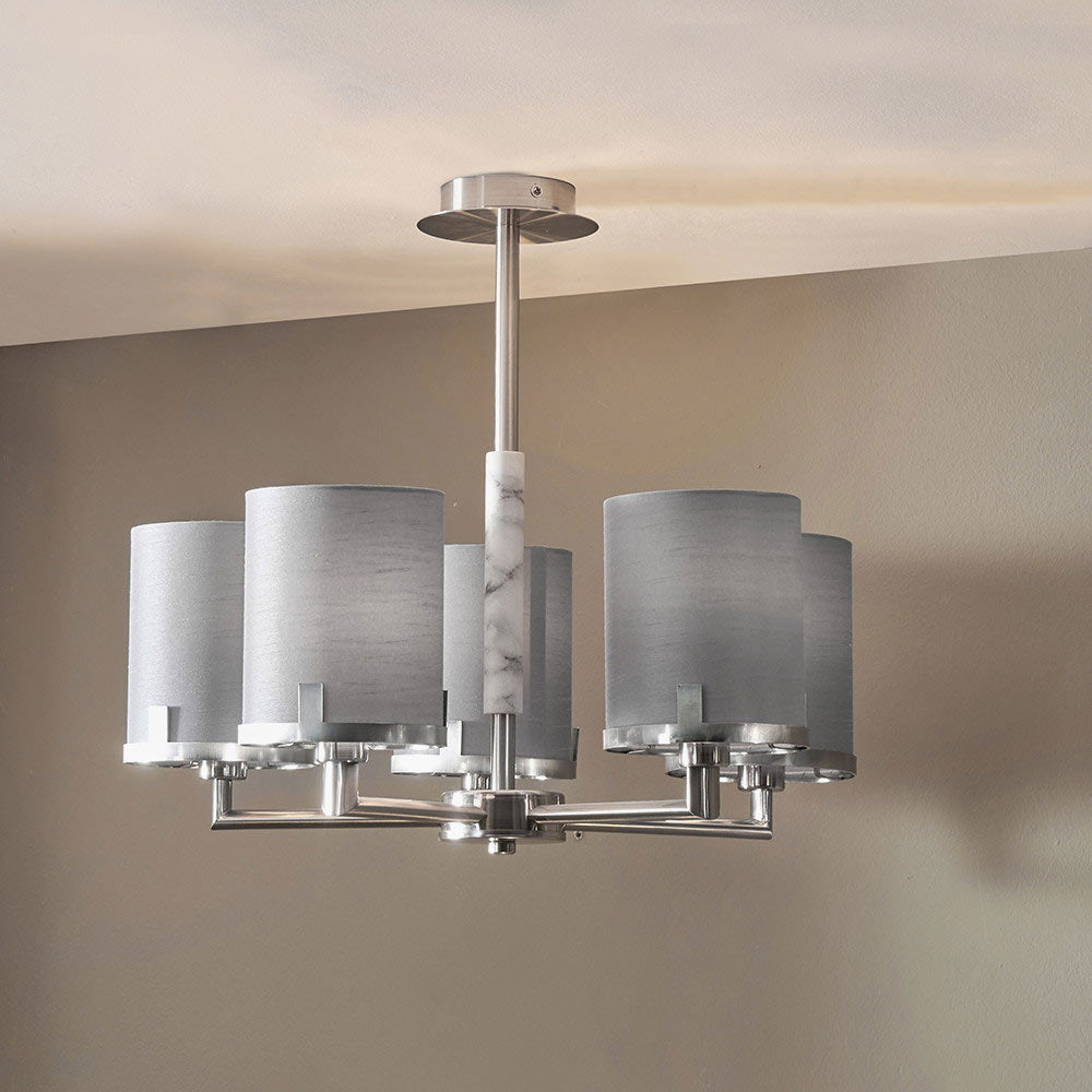 Brushed nickel pendant lights being used in a living room