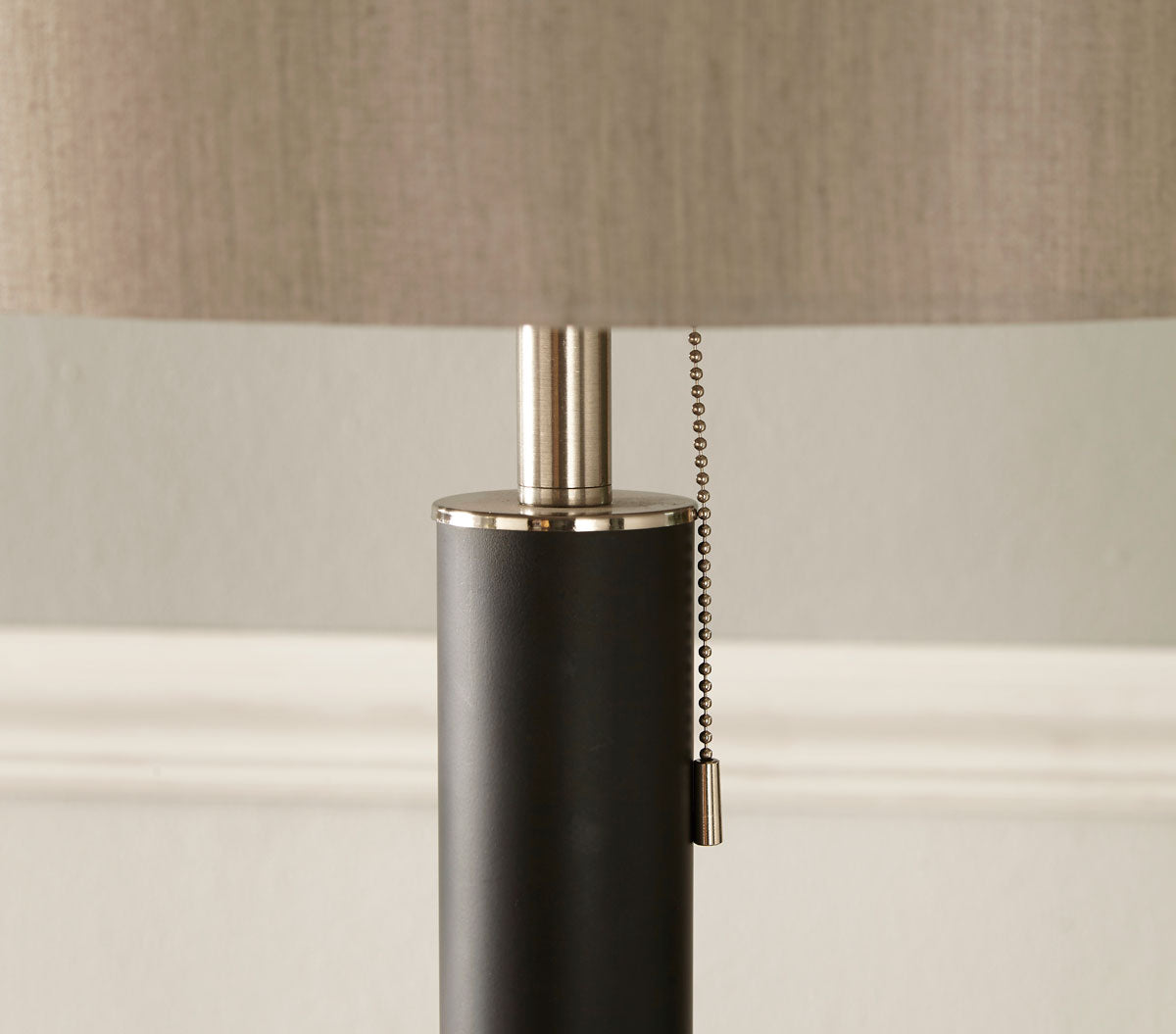 Contemporary floor lamp pull switch shown in living room