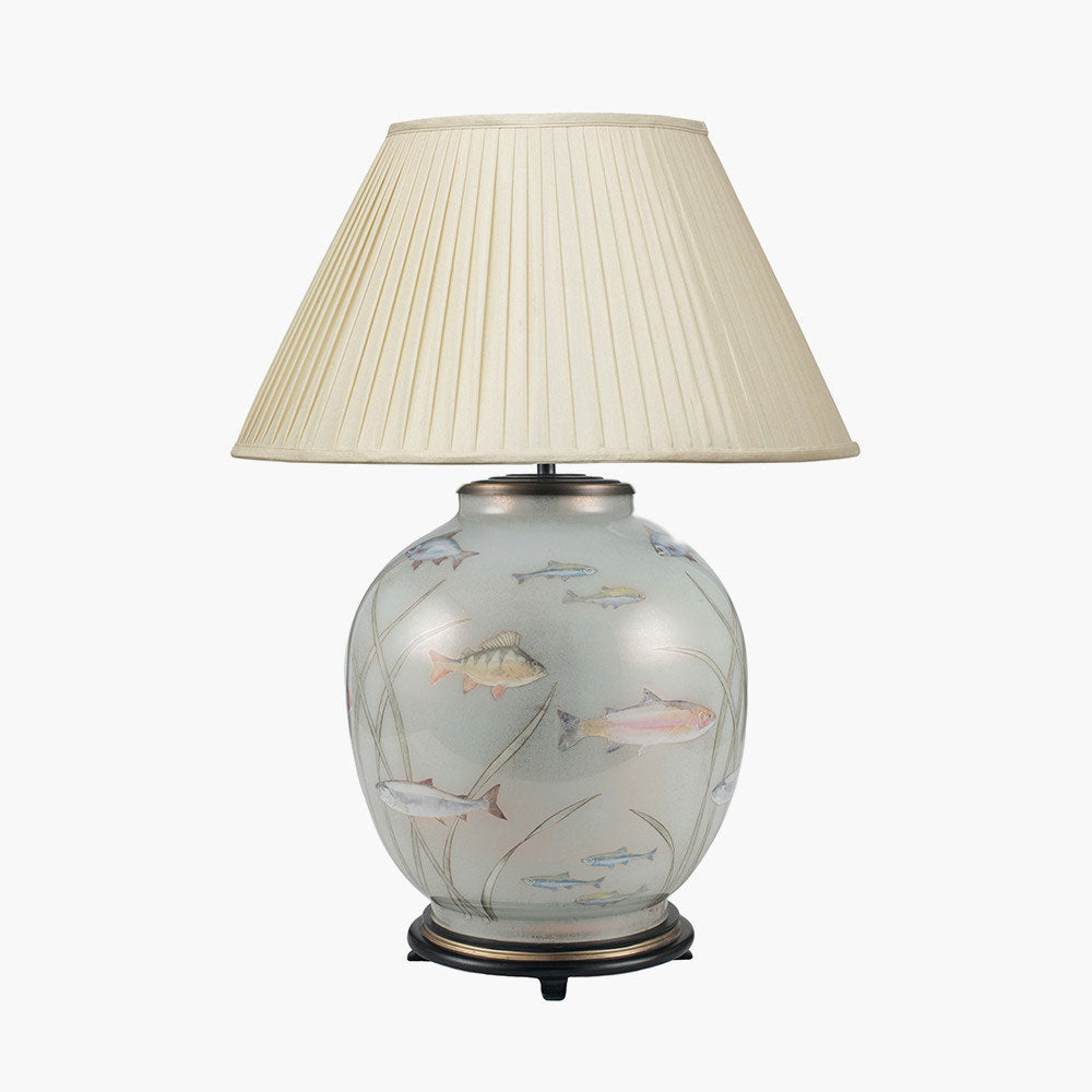 The Jenny Worrall Fish Large Glass Table Lamp is shown here with an empire lampshade, both of which are sold by South Charlotte Fine Lighting