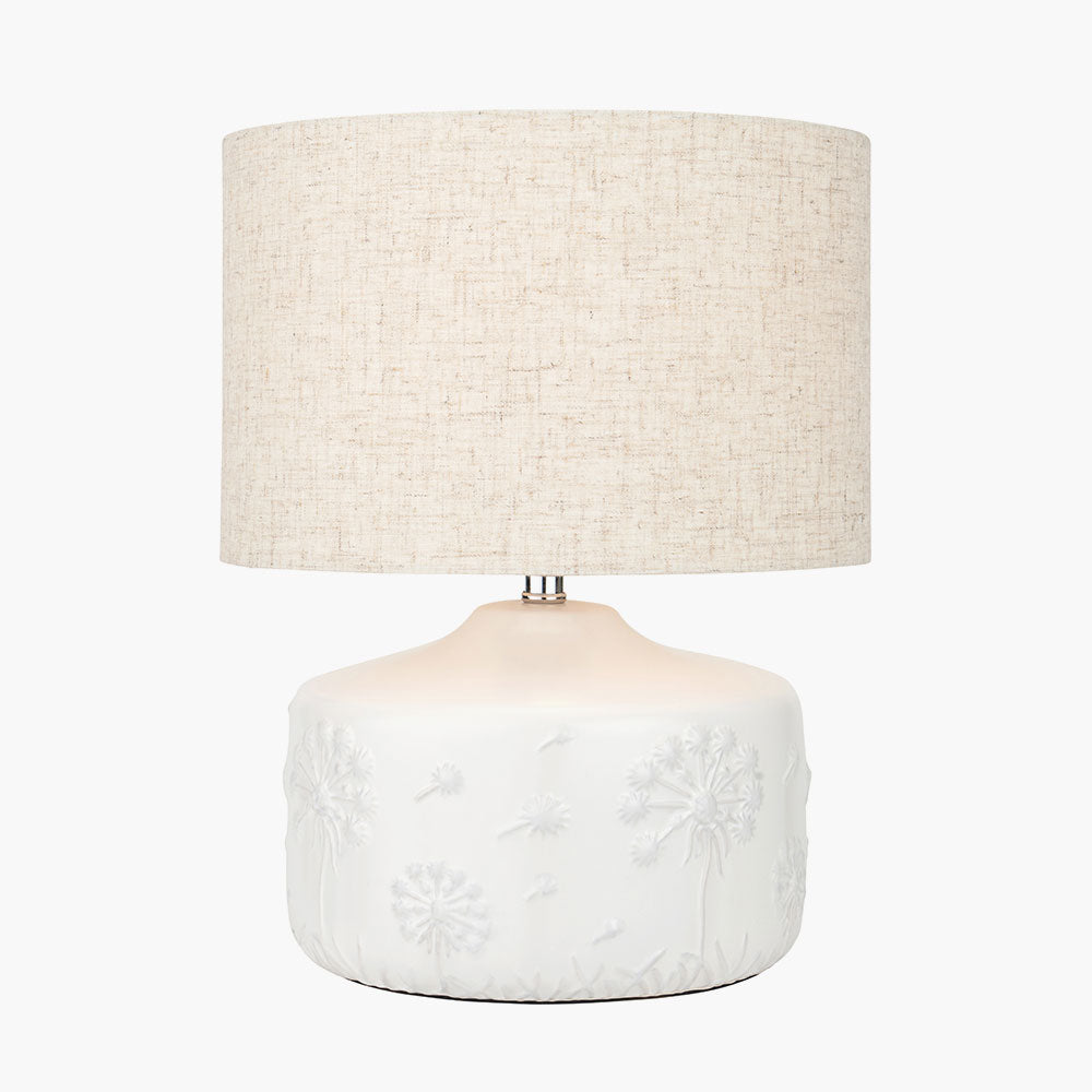 Flora White Small Floral Ceramic Table Lamp lit up