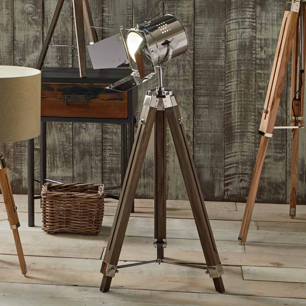 The grey tripod floor lamp from South Charlotte Fine Lighting is fully adjustable