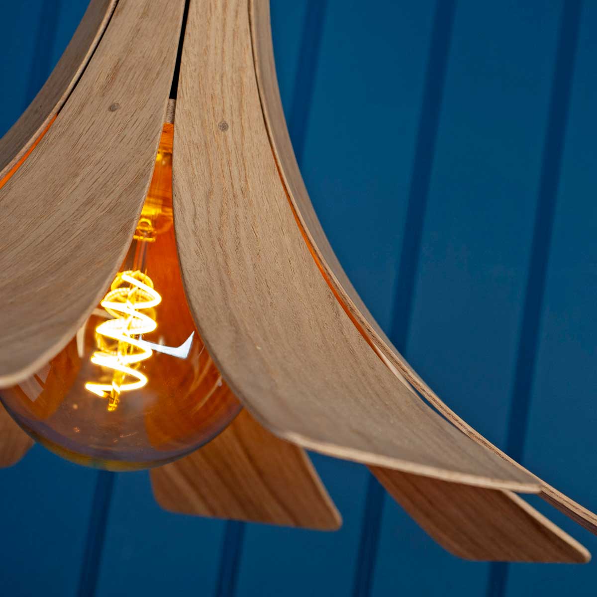 Detail on oak pendant light made by Storm Furniture and sold by South Charlotte Fine Lighting
