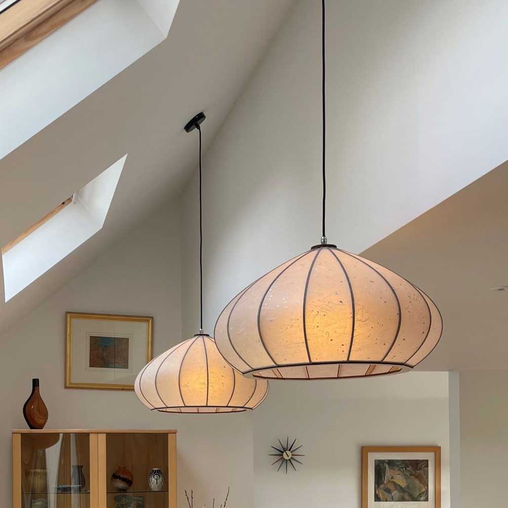 The Mushroom Washi pendant light is supplied with a warm coloured bulb when sold by South Charlotte Fine Lighting