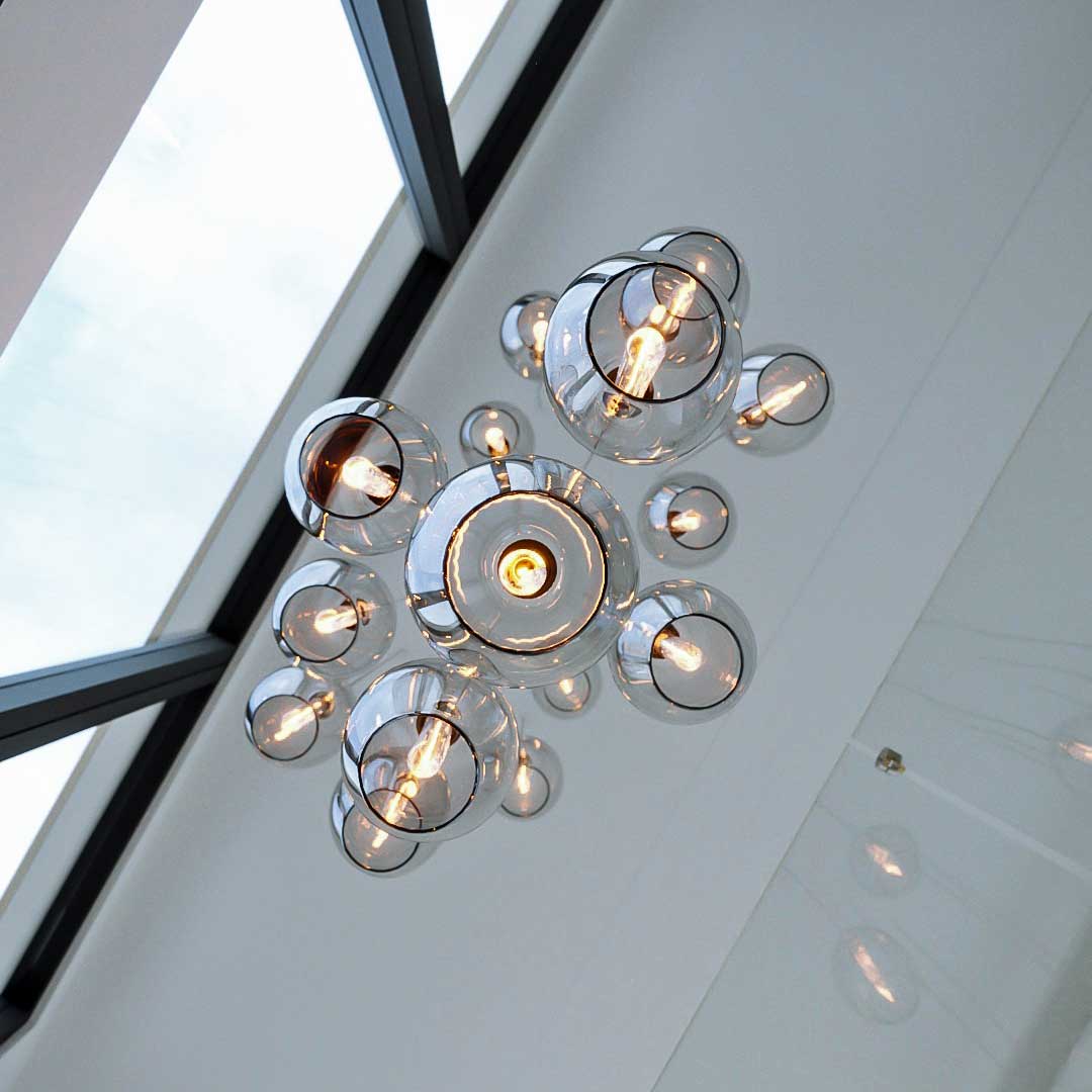 Pendant light cluster with Victoria Pendant made by Leverint and sold by South Charlotte Fine Lighting