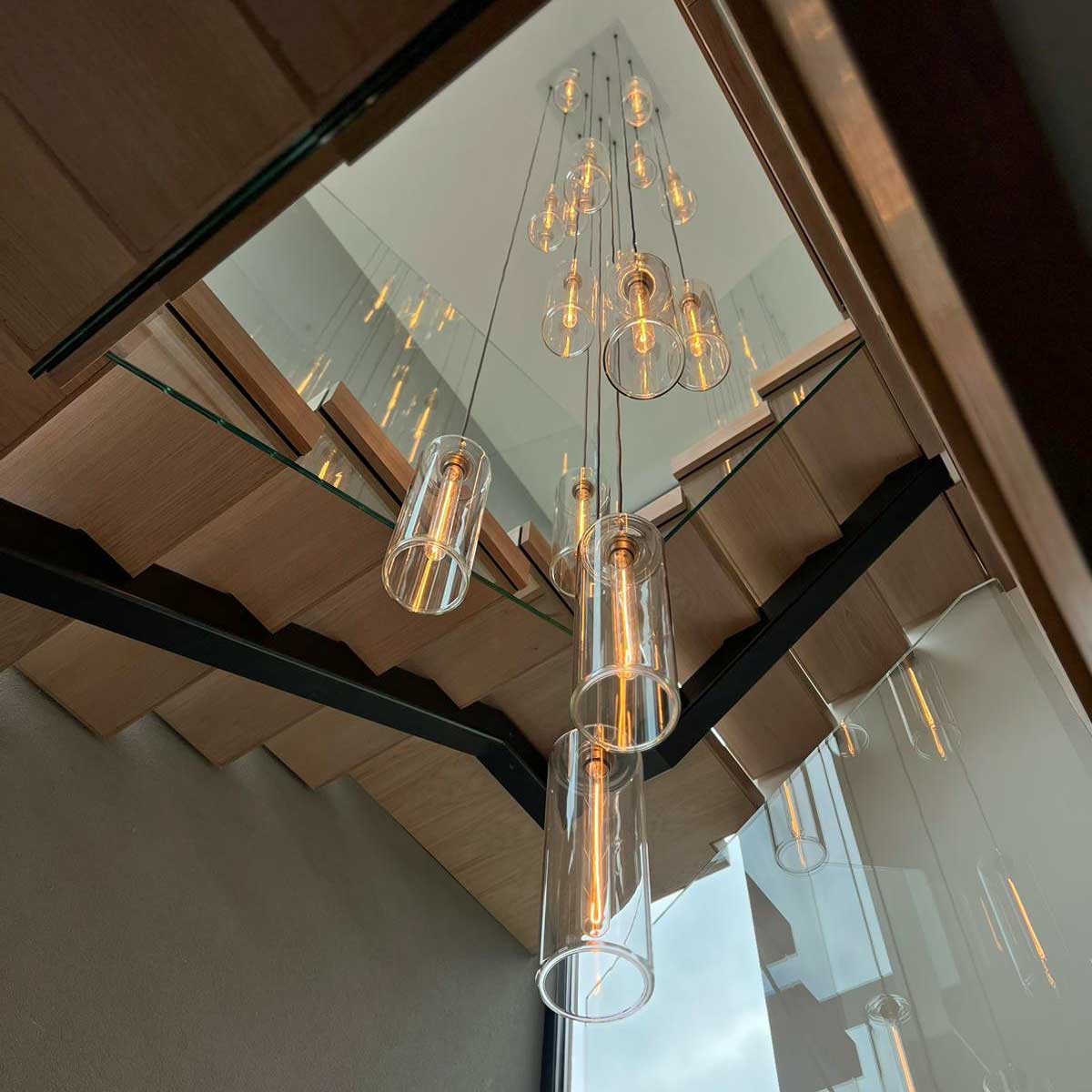 Stairwell with pendant light cluster sold by South Charlotte Fine Lighting and featured on Channel 4's programme Grand Designs