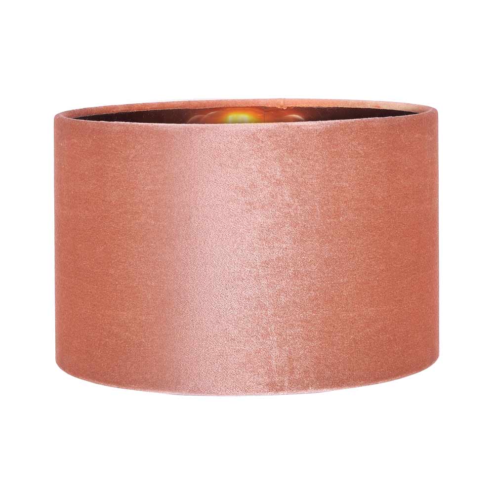 Bow cylinder apricot velvet lamp shade, shown here with a lightbulb in use