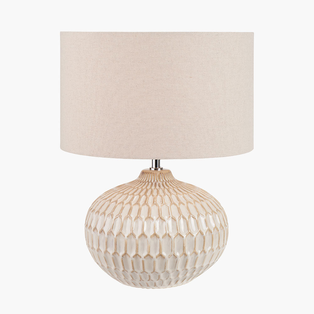 Cassius Warm White Textured Glazed Ceramic Table Lamp lit up