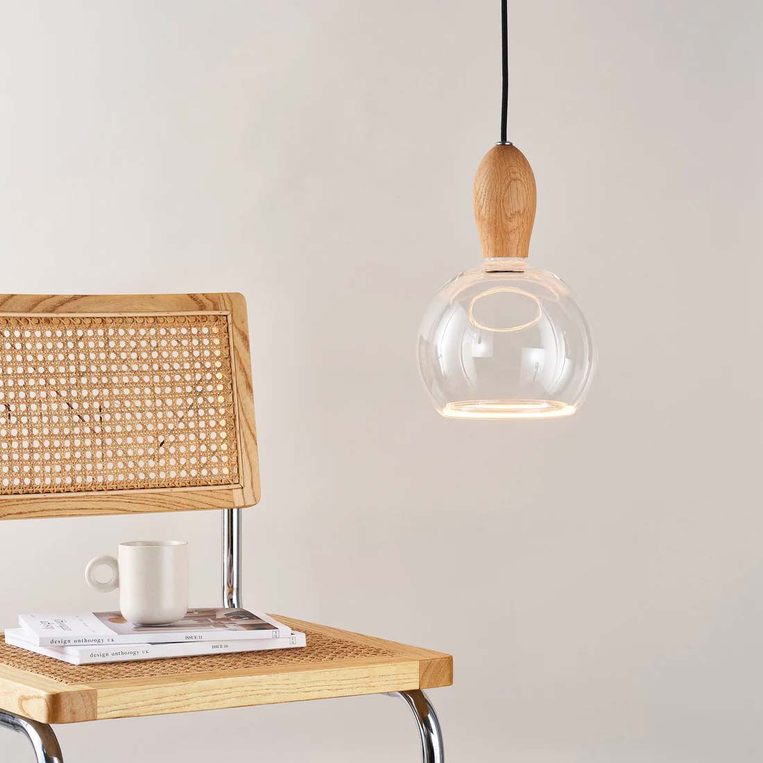 The Woody is a single wooden pendant light, shown here made from oak and supplied by South Charlotte Fine Lighting