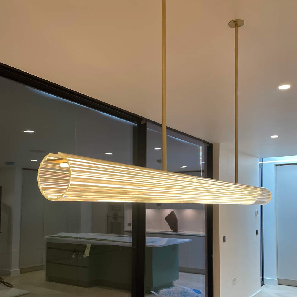 Alternative close-up of Temple Rod Pendant light during installation into a kitchen