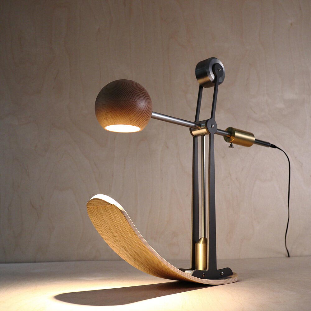 The Blott Works B-Type Balance Lamp is an innovative designer desk lamp sold by South Charlotte Fine Lighting