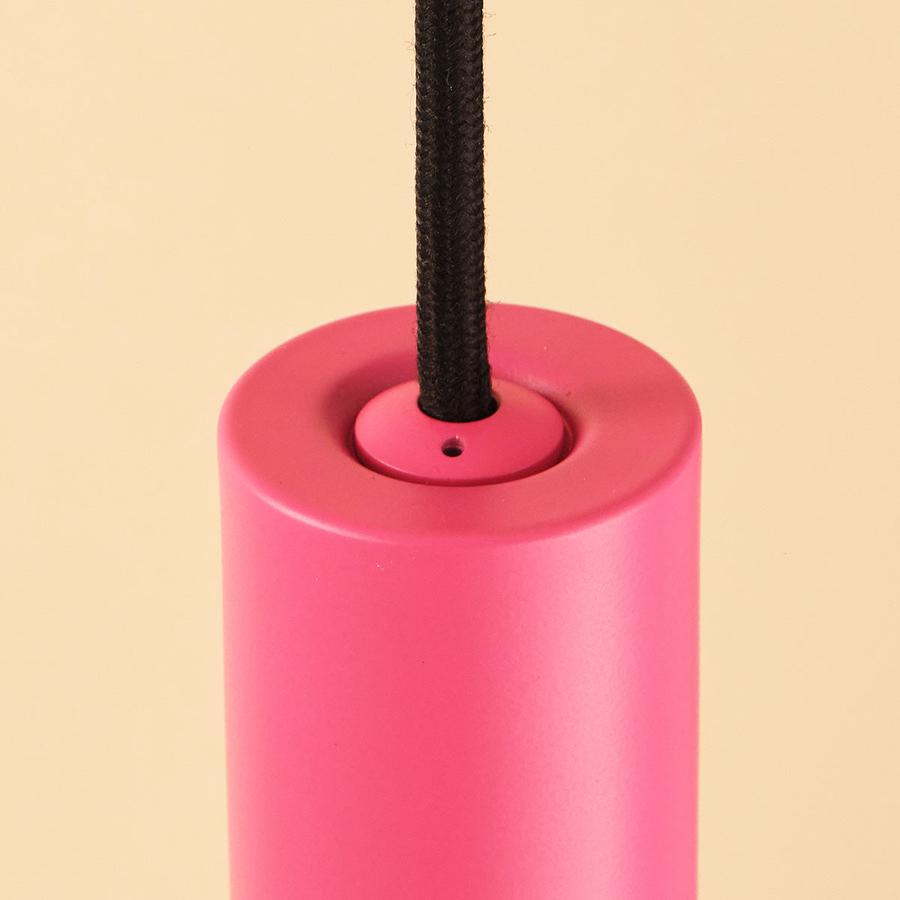 The Well Lit Spin in Pink Positive features a pendant body made from recycled materials and black cable and is sold by South Charlotte Fine Lighting