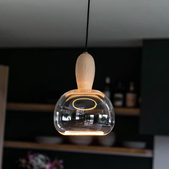 The Azure Soft pendant light bulb shown here with the Well Lit Woody pendant