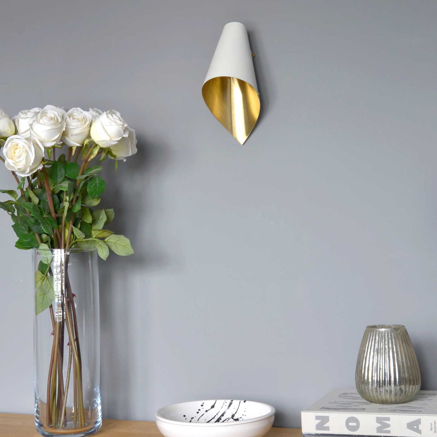 South Charlotte-suppled Arcform ARC Wall Light in white and brushed brass for living room