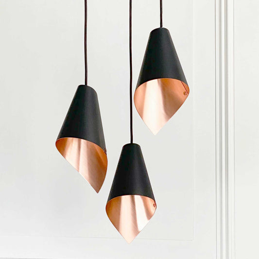 ARC 3 black and copper pendant lights for your dining room – supplied by South Charlotte Fine Lighting