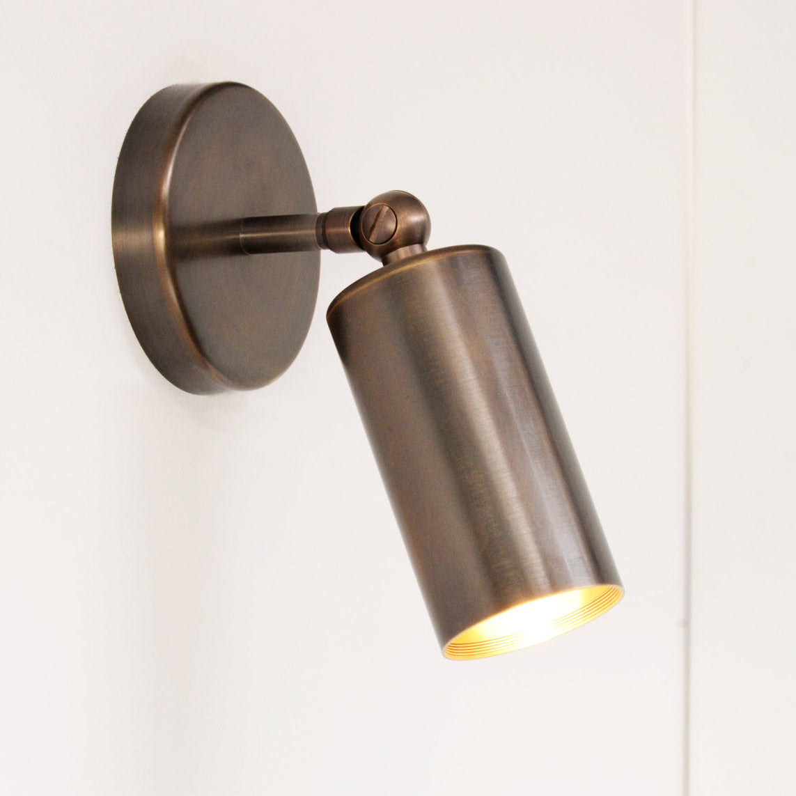 South Charlotte-suppled Arcform VIDERE Wall Light in bronze is great for home hallways 