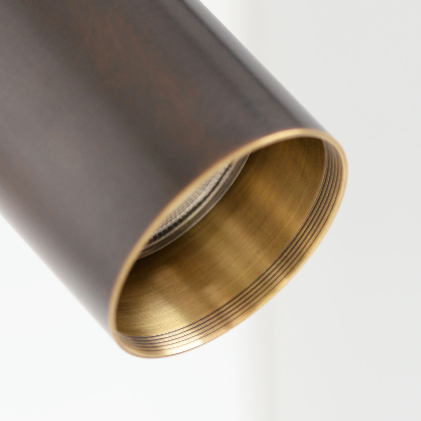 Detail on Arcform VIDERE in bronze, can be used as a bedroom wall light, supplied by South Charlotte Fine lighting