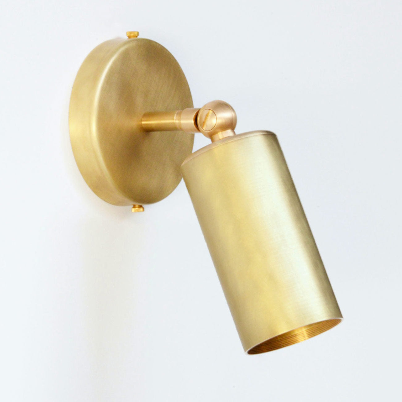 South Charlotte-suppled Arcform VIDERE Wall Light in brushed brass can also be used in hallways 