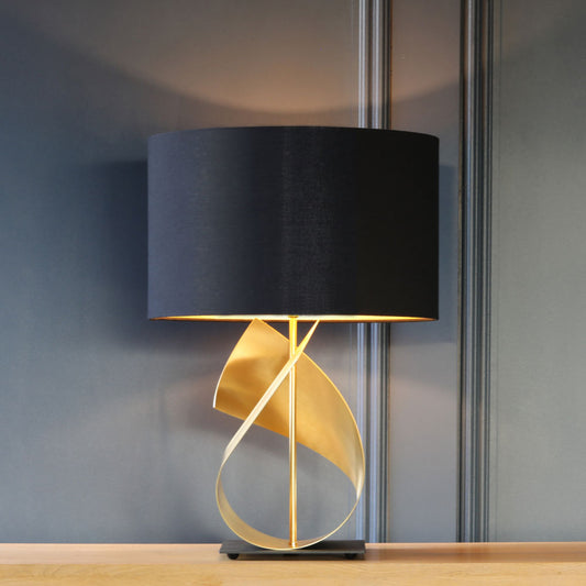 South Charlotte Supplied FLUX table lamp in brushed brass with an optional blue shade