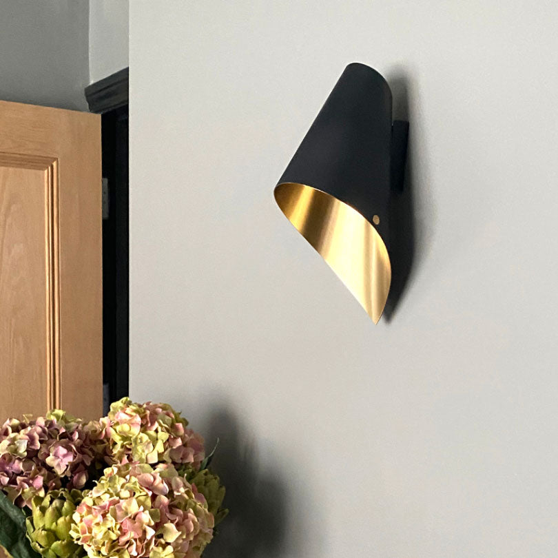 South Charlotte-suppled Arcform ARC Wall Light in black and brushed brass for living room